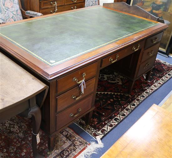 A late Victorian mahogany six drawer leather topped desk W.168cm.